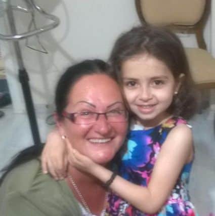 Sylwia Borowska with one of the children she has helped in Istanbul, Turkey.