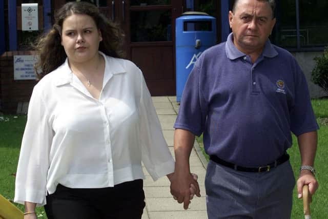 Geoff Taylor leaves the inquest into Andrea's death death at St Helens Coroners Court in 2001 with his other daughter, Helen